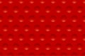 Seamless abstract red texture background with round cavities